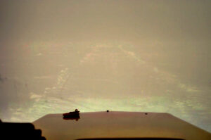 Concordia traverses – image of the track lit by floodlights during white-out conditions and bad weather